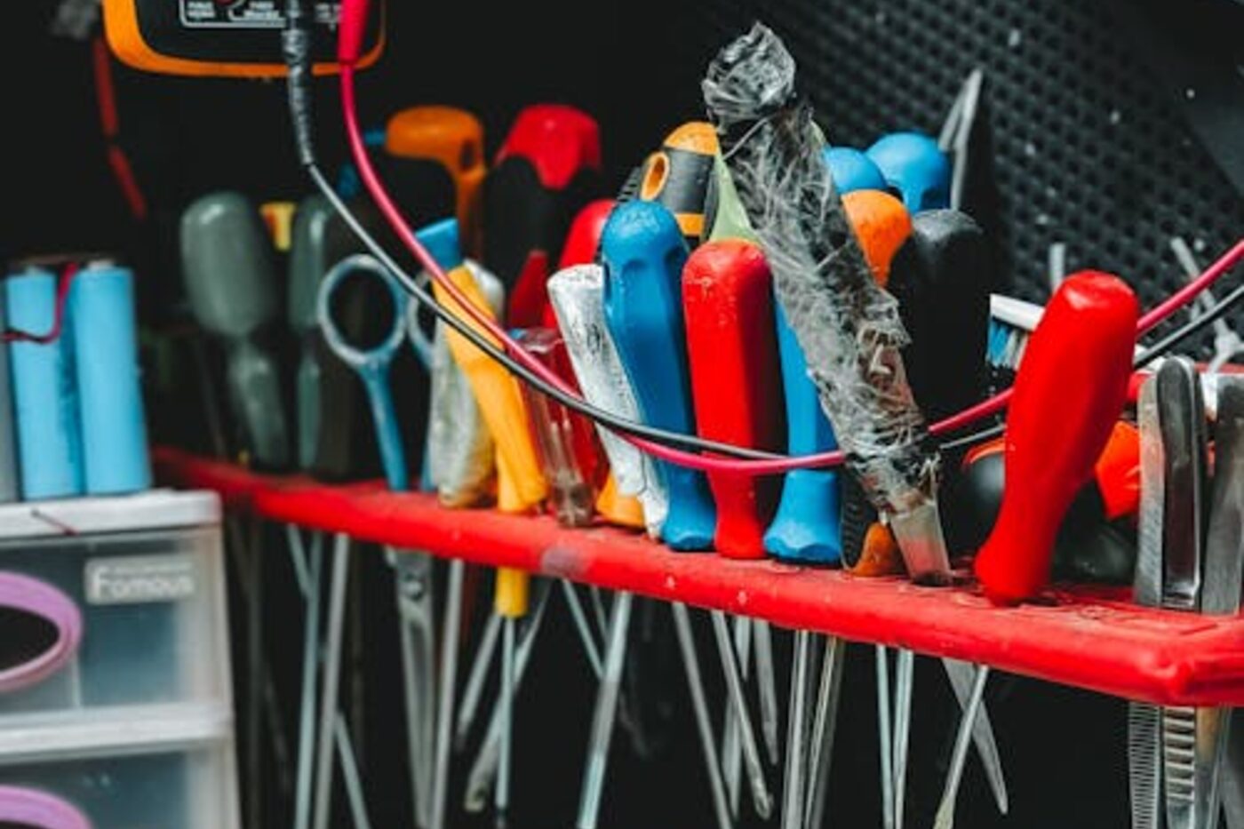 Organized wall of hand tools in a workshop